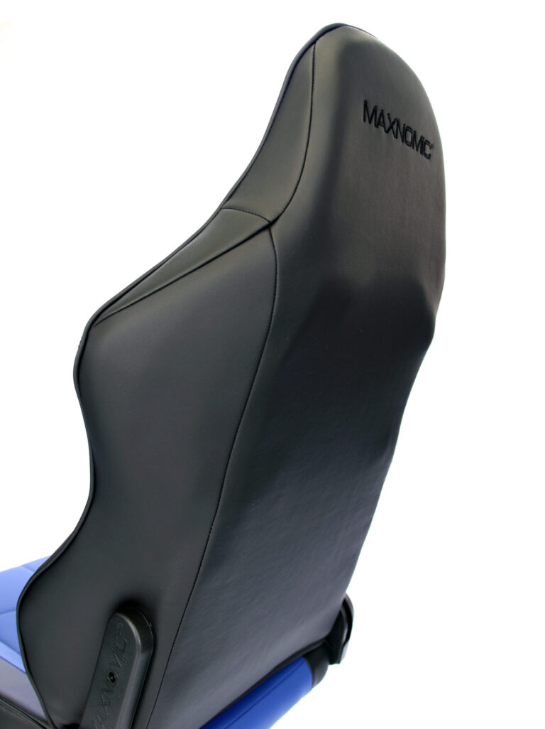 Close-up of the upper part of the backrest of the Maxnomic® Leader Blue from behind, with the Maxnomic® logo embroidered in black.