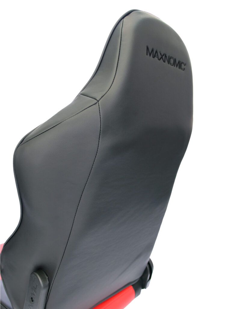 Close-up of the upper part of the backrest of the Maxnomic® Leader Red from behind, with the Maxnomic® logo embroidered in black.